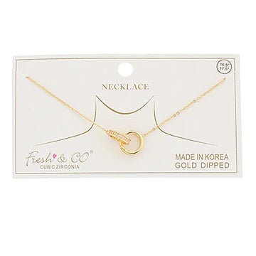 Double link chain on card with necklace on white background