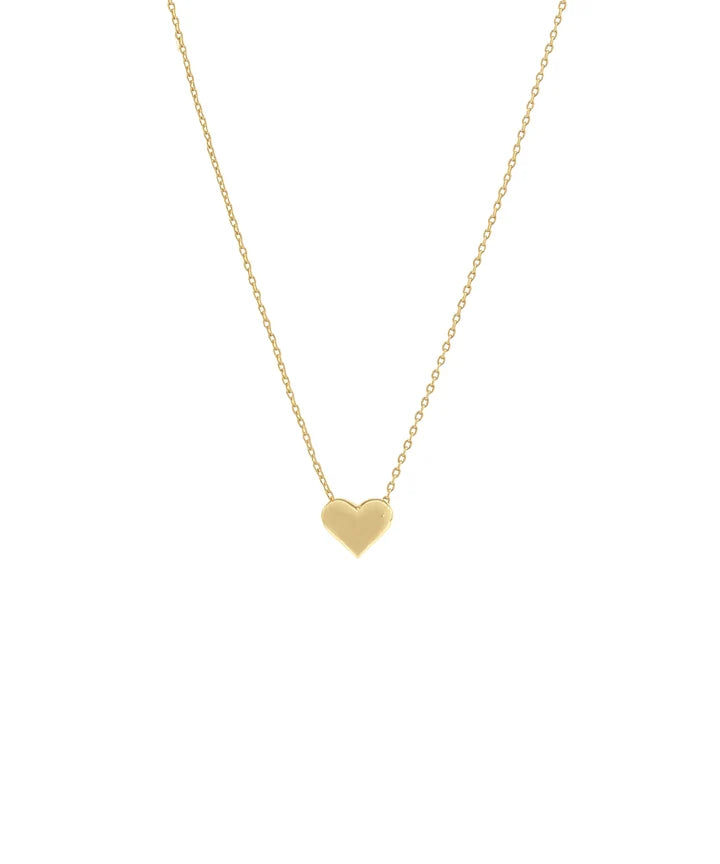 A delicate gold chain necklace with a small, polished gold heart pendant, centered against a solid white background.