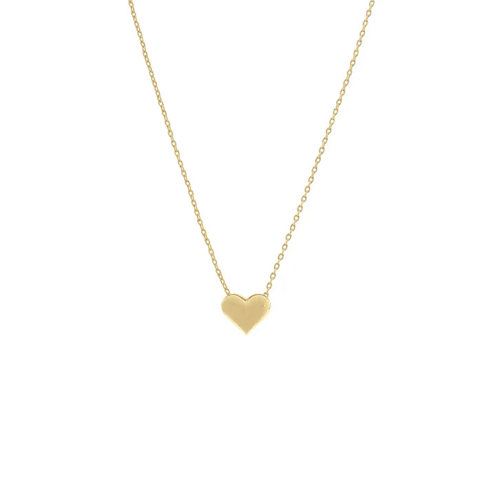 A delicate gold chain necklace with a small, polished gold heart pendant, centered against a solid white background.