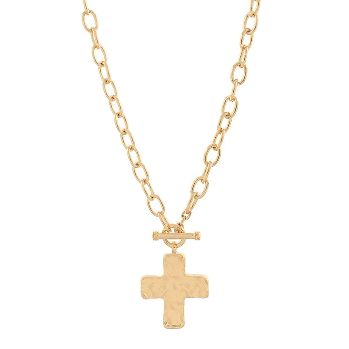 A gold chain necklace with a textured cross pendant and a toggle clasp, shown against a plain white background.