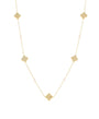 A delicate gold chain necklace featuring five textured gold quatrefoil (clover) charms spaced evenly along the chain, with small pale pink beads interspersed, set against a solid white background.