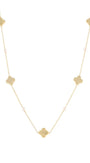 A delicate gold chain necklace featuring five textured gold quatrefoil (clover) charms spaced evenly along the chain, with small pale pink beads interspersed, set against a solid white background.