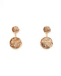 Pair of gold earrings on a white background