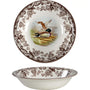 Decorative ceramic plate with bird design and floral patterns on a white background