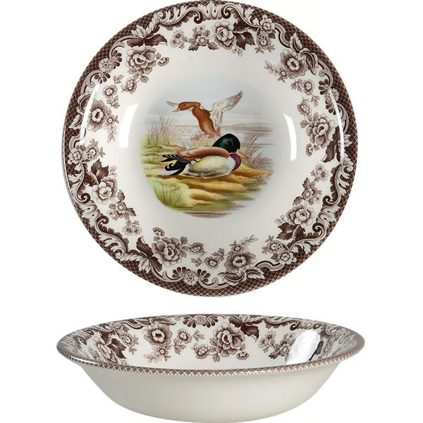 Decorative ceramic plate with bird design and floral patterns on a white background