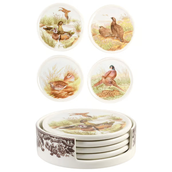Set of ceramic coasters with bird illustrations on a white background