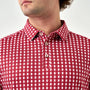 Red patterned shirt worn by a person on a white background