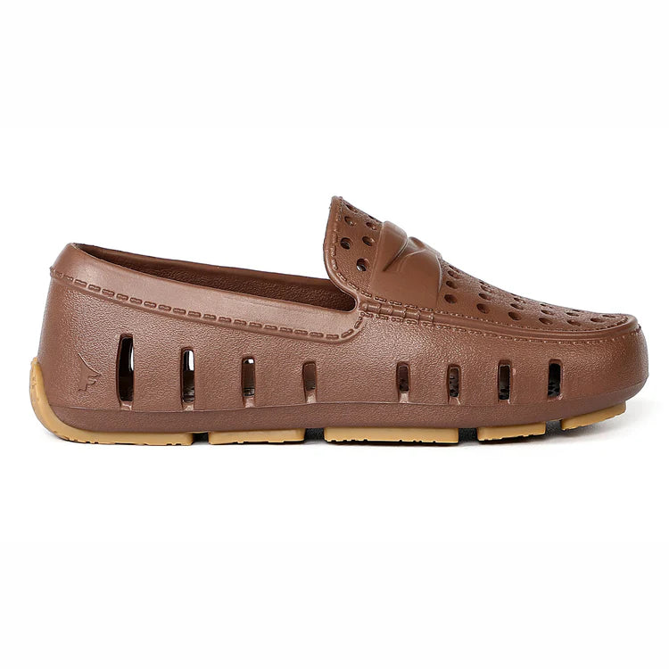 Brown loafer shoe with cut-out design on a white background