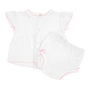 White baby diaper set with pink trim on a white background
