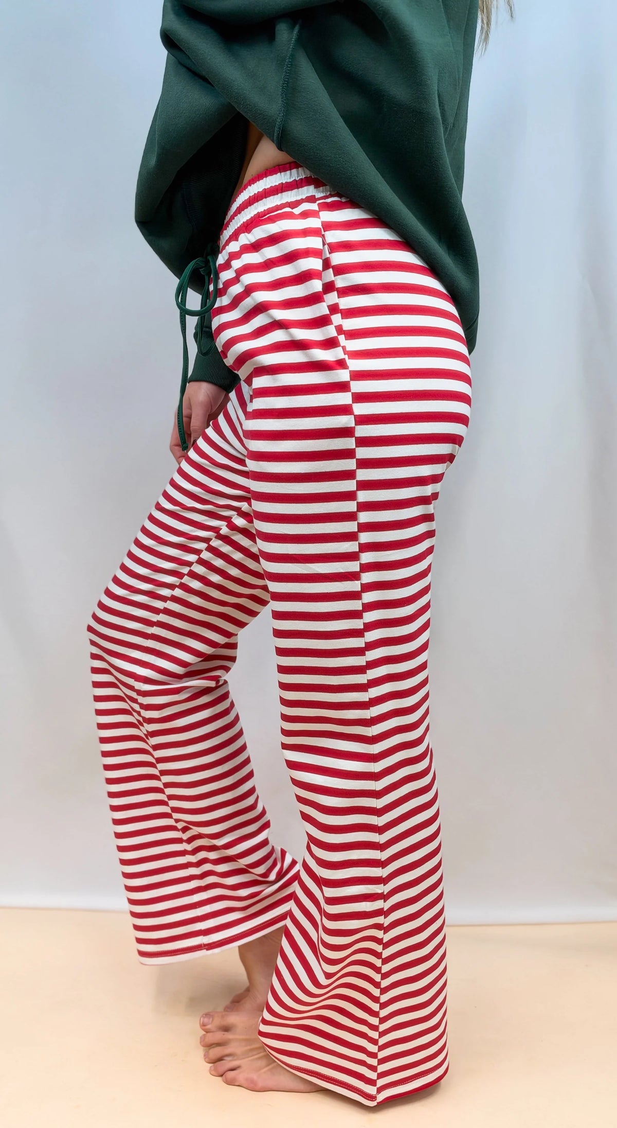 Red and white striped lounge pants with drawstring waist, flared relaxed fit