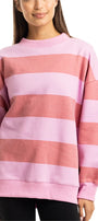 Person wearing a pink and red striped sweater on a white background