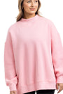 Woman wearing a pink sweatshirt on a white background