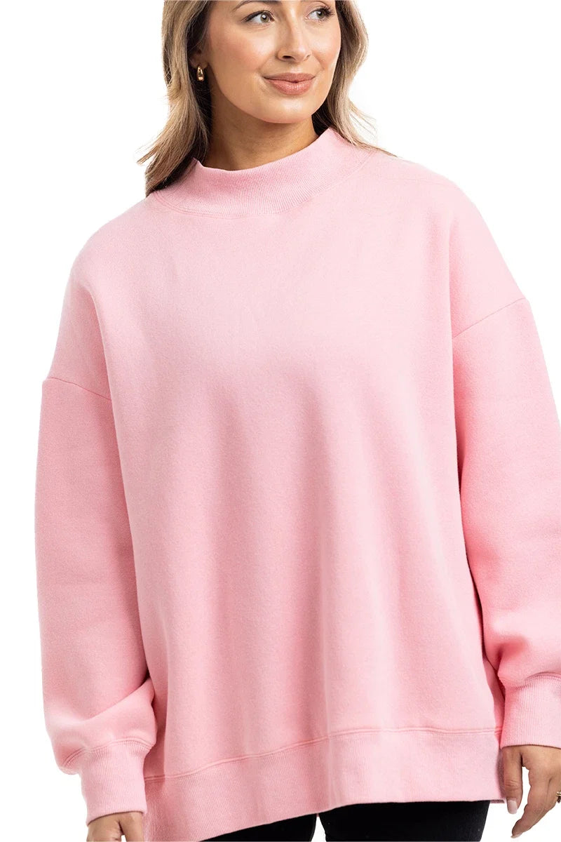 Woman wearing a pink sweatshirt on a white background