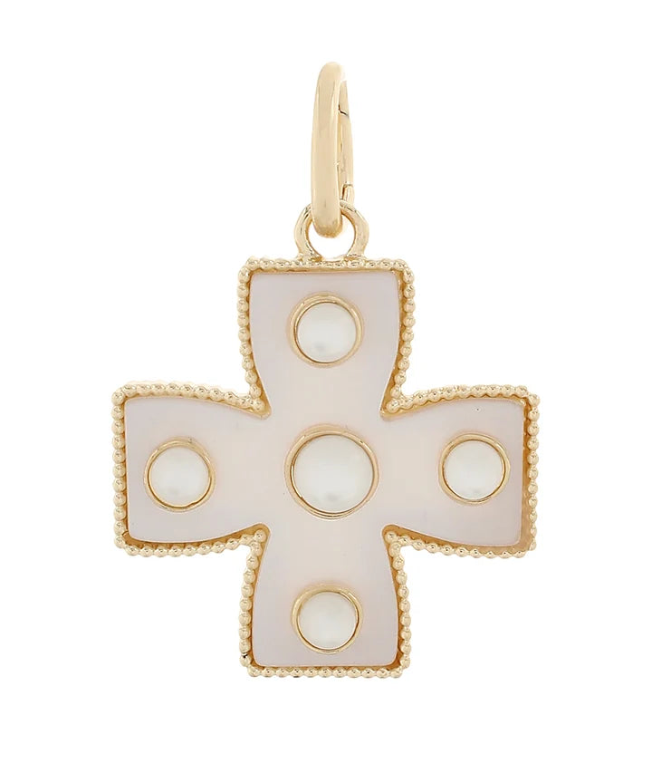 A gold cross pendant featuring a pearlescent white inlay with circular cutouts, set against a plain white background.