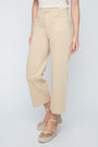 Beige pants worn by a person on a white background