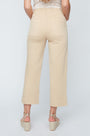 Beige pants worn by a person on a light gray background