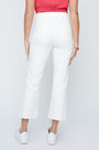 Person wearing white pants on a plain background