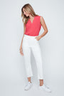 Woman wearing a pink sleeveless top and white pants on a white background