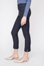 Person wearing navy blue pants and a blue top on a white background