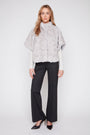 Grey faux fur cape poncho with high collar and loose poncho silhouette