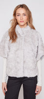 Light grey faux fur poncho with high neckline and textured shaggy finish
