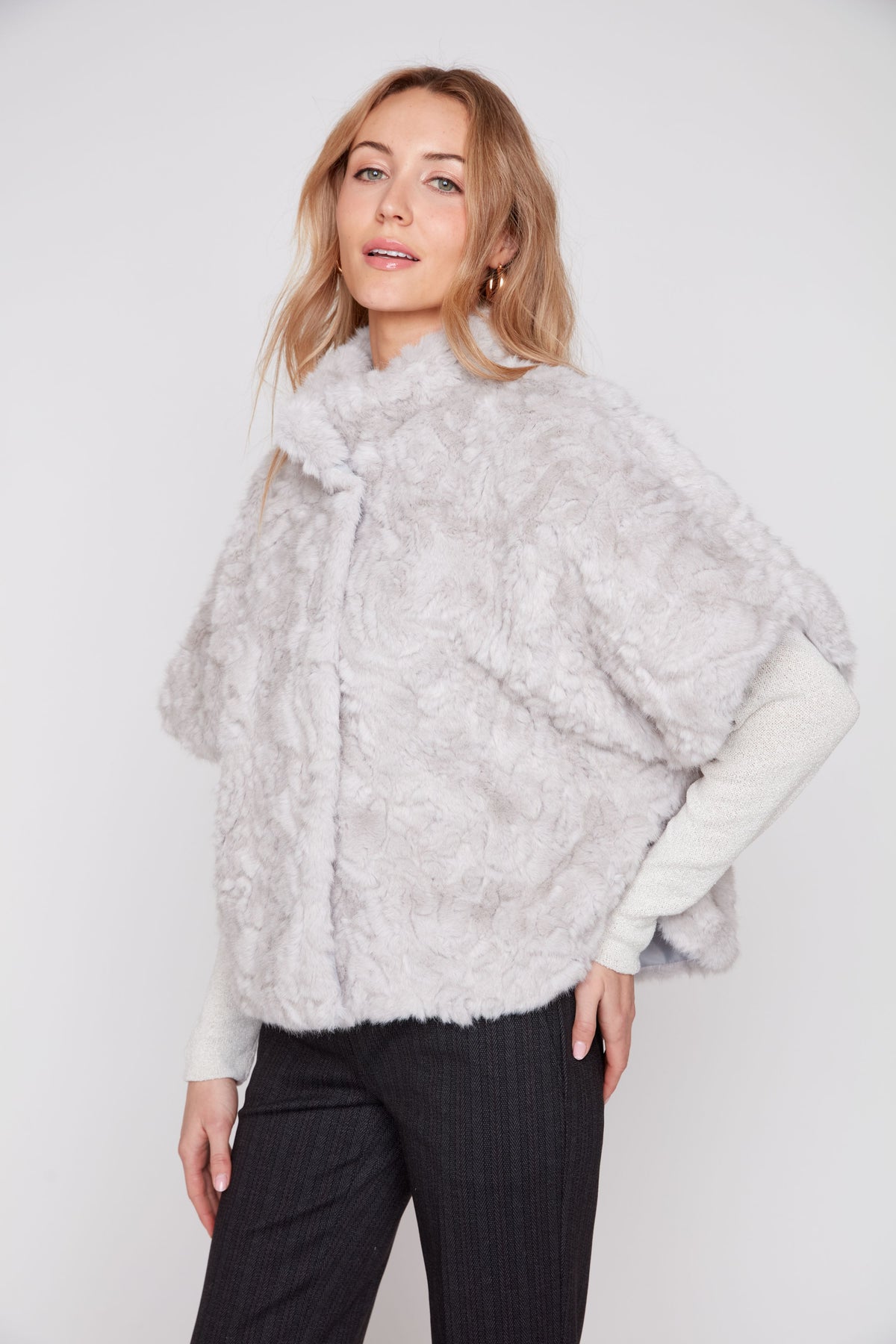 Grey faux fur poncho with high collar and draped cape sleeves