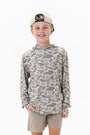 Child wearing a camouflage hoodie and beige shorts on a white background