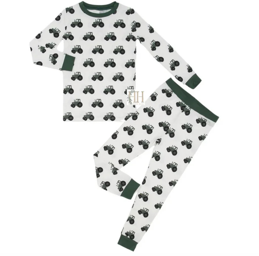 Children's pajama set with tractor pattern on a white background