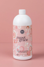 Bottle of Sweet Grace laundry detergent on a pink background