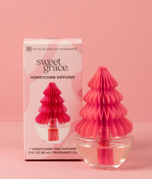Pink honeycomb diffuser with packaging on a pink background