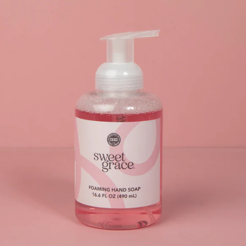 Bottle of sweet grace foaming hand soap on a pink background