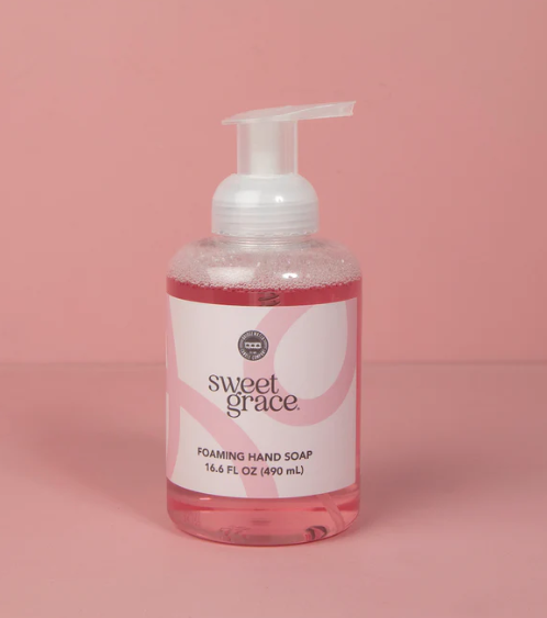 Bottle of sweet grace foaming hand soap on a pink background