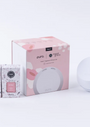 Pura smart fragrance diffuser set with packaging on a white background