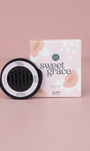 Car air freshener and packaging with 'sweet grace' branding on a pink background