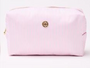 Pink ribbed clutch bag with a gold clasp on a white background