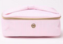 Pink cosmetic bag with gold zipper on a white background