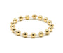Gold beaded bracelet on a white background