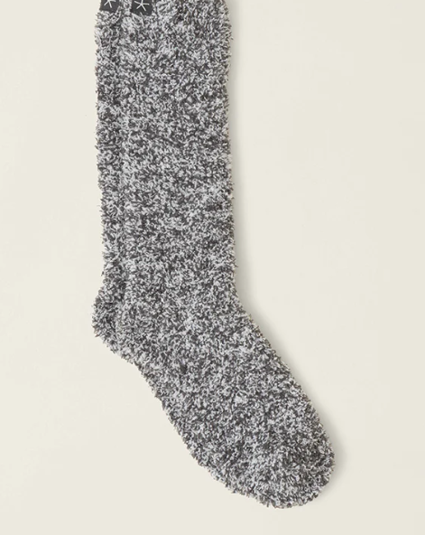 Gray textured sock on a beige background