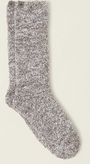 Fluffy gray sock on a light beige background