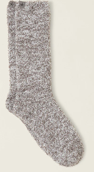 Fluffy gray sock on a light beige background