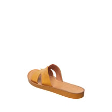 Tan sandal on a white background