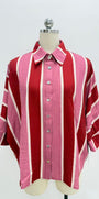 A pink and red striped button-down shirt with white stripes, displayed on a mannequin torso against a white background.