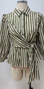 A green and off-white vertically striped wrap blouse with puff sleeves, displayed on a beige mannequin torso against a plain light gray background.