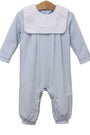 A baby long-sleeve footless romper with a white bib collar, featuring fine light blue and white stripes, hanging on a wooden hanger against a white background.
