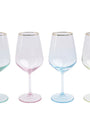 Four wine glasses with pastel-colored bases on a white background