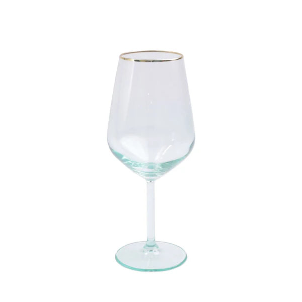Clear wine glass with gold rim on a white background
