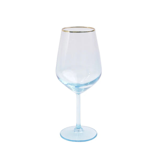 Clear wine glass with gold rim on a white background