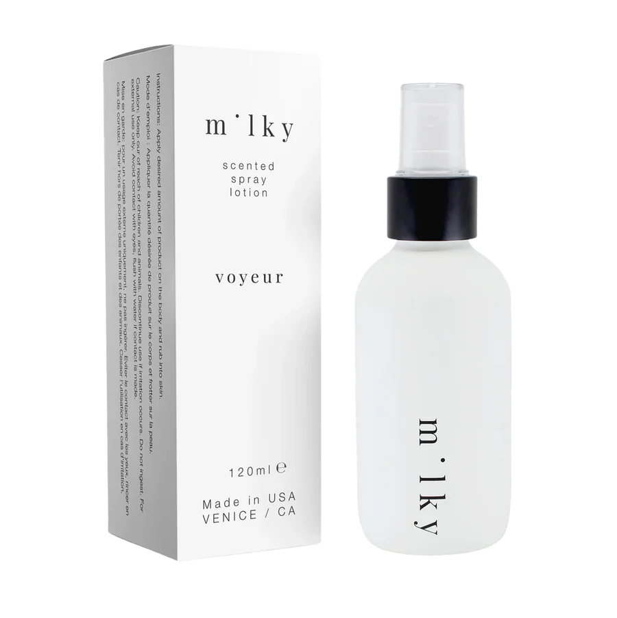 Milky scented spray lotion with packaging on a white background