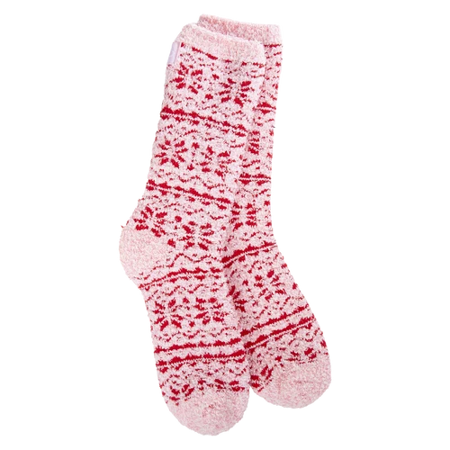 A pair of fuzzy knit socks in light pink with a red Nordic-style pattern, shown against a plain white background.