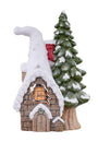 Small snowy cabin with a tree next to it on a white background